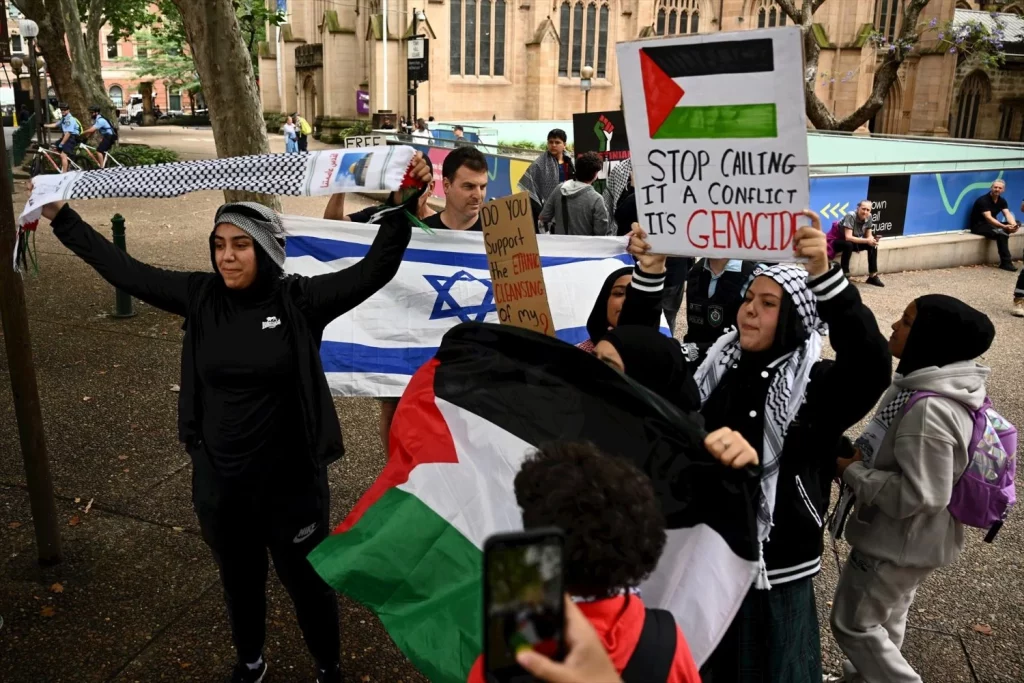 EuropaPress 5596253 two men with an israeli flag attend rally during high schoolers for Moncloa